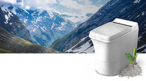 Modern incineration toilet in a scenic mountain landscape, showcasing eco-friendly sanitation solutions.