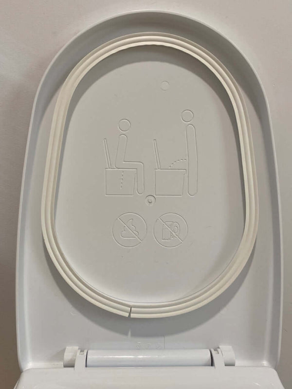 Image of a urinal gasket with user instructions and safety icons on a white background.